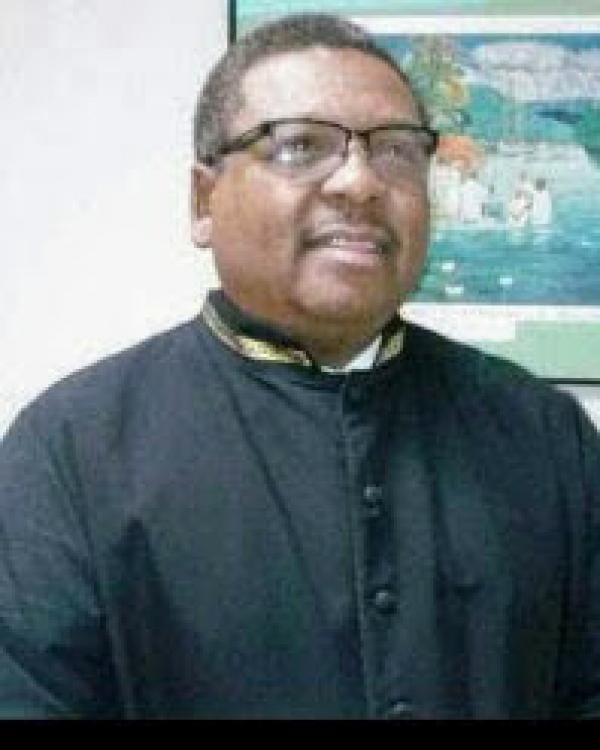 Donald King Donald King Cornerstone College & Seminary Smiling man in a black clerical shirt and glasses, indoors, facing slightly to the right. Donald King